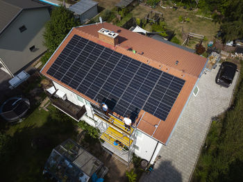 Installation of solar panels on roof of house