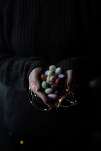 High angle view of person holding multi colored candies