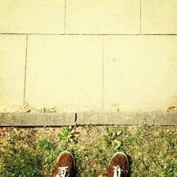 Low section of woman standing on ground