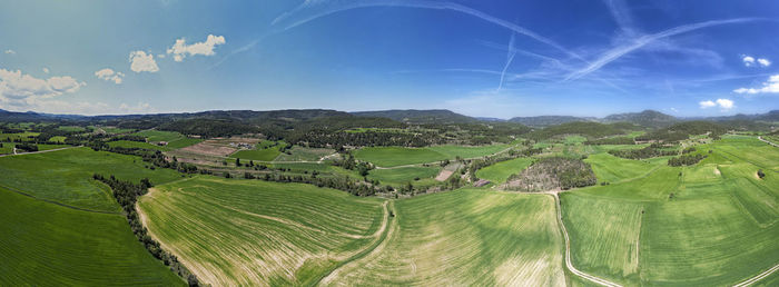 Drone panoramic view of green agricultural fields in spring time in matarraña region in spain