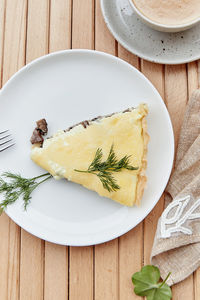 Vegetarian cheese pie with mushrooms . cup of coffee, healthy breakfast. mediterranean cuisine.