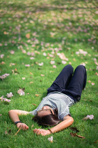 Woman lying on lawn