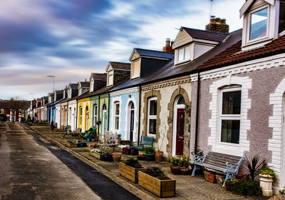 Buildings in city against sky