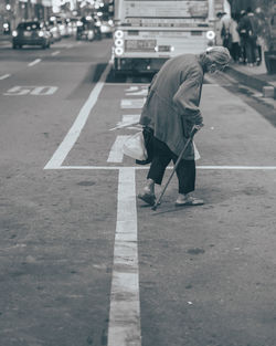 Rear view of man walking on street