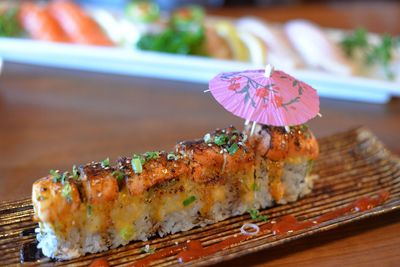 Sishi roll on a plate with umbrella 