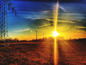 Scenic view of field against sky during sunset
