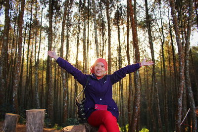 Portrait of young woman in forest