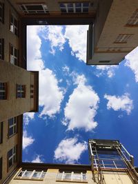Low angle view of building against blue sky
