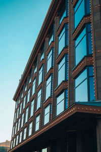 Modern office building, detailed view of finance house windows. pattern. office building, blue glass