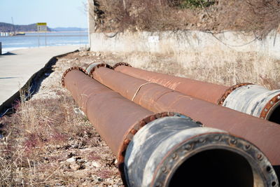 Close-up of metallic pipes outdoors