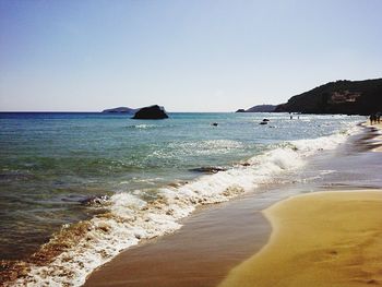 View of beach against clear sky