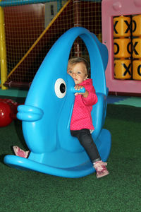 Cute girl playing on toy