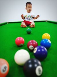 Full length of boy playing with ball