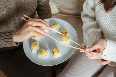 Midsection of woman having food