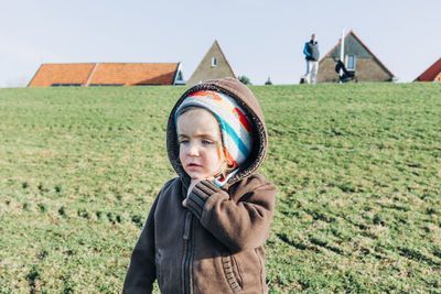 Portrait of boy wearing sunglasses on field