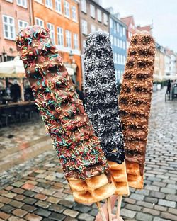 Close-up of ice cream hanging in city