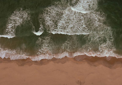 High angle view of surf on beach