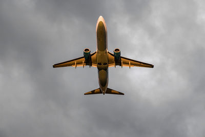 Low angle view of airplane against sky