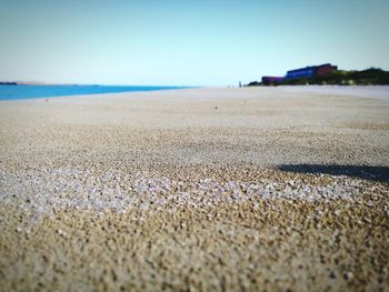 Scenic view of beach against clear sky