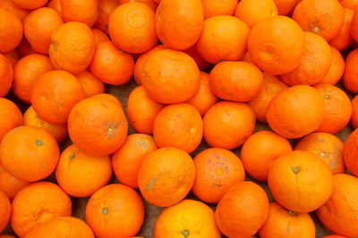 Full frame shot of oranges at market stall