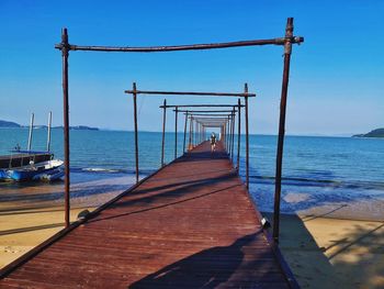 Pier over sea against sky