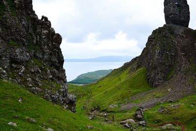 Scenic view of landscape against cloudy sky