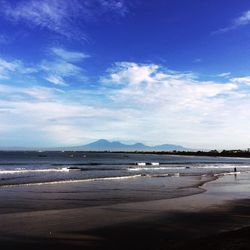 Scenic view of sea against blue sky