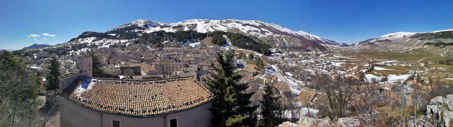 Panoramic view of buildings on mountain against sky