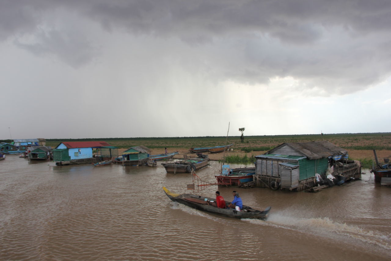 BOATS ON BEACH AGAINST SKY