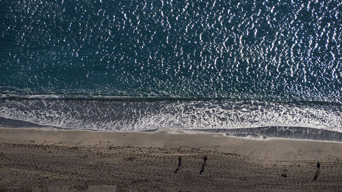 Scenic view of beach against sky at night