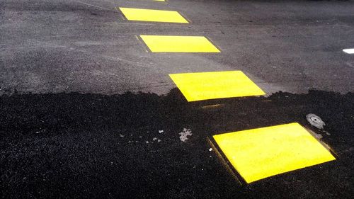 High angle view of arrow sign on road