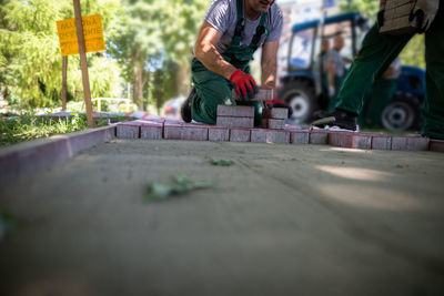 Low section of man working at construction site