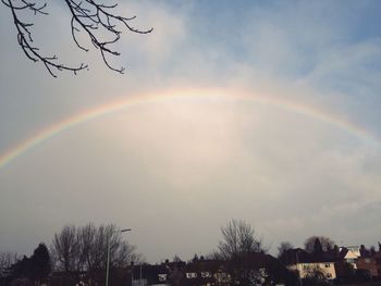 Scenic view of rainbow over mountains