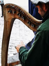 Low angle view of man playing piano