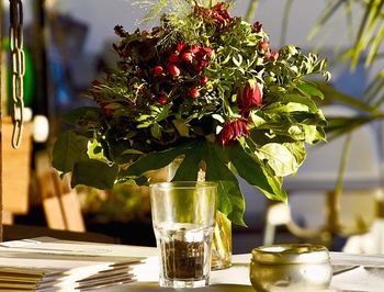 Close-up of red rose in vase on table