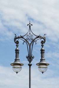 Low angle view of street light against sky