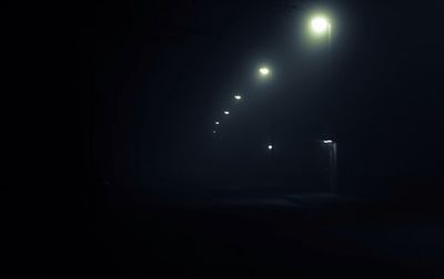 Illuminated street light at night