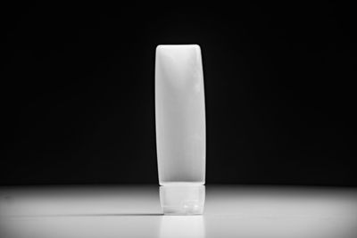 Close-up of white candle on table