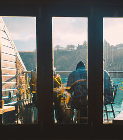 Panoramic view of city seen through glass window