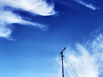 Low angle view of wind turbine against sky