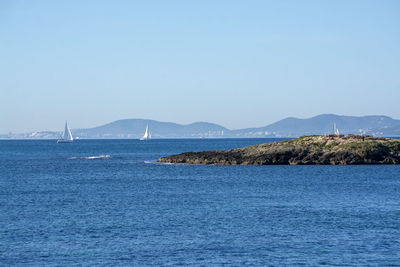 Scenic view of sea against clear sky