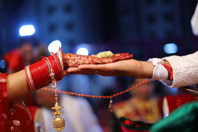 Cropped hand of bridegroom during wedding ceremony
