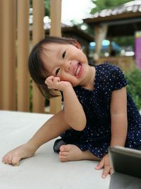 Close-up portrait of smiling girl