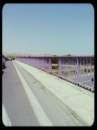 Empty road against clear sky