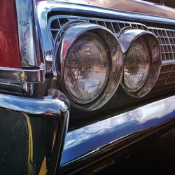 Close-up of vintage car headlights