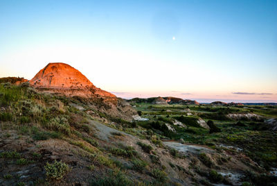 Scenic view of mountain against blue sky