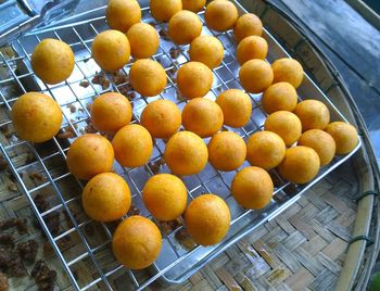 High angle view of oranges in container