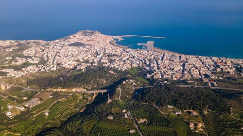 High angle view of land and mountains against sky