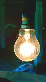 Close-up of illuminated light bulb