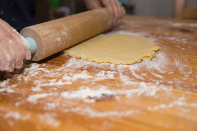 Cropped image of person making cookies